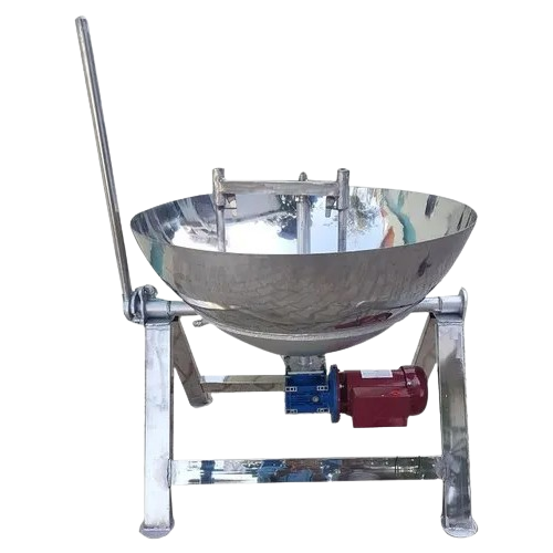 A polished stainless steel khoya kadhai, a large, wok-like vessel, is mounted on a sturdy stand. It features a long stirring handle on the left and a red and blue motor assembly underneath, indicating it's a mechanical stirrer for continuous cooking.