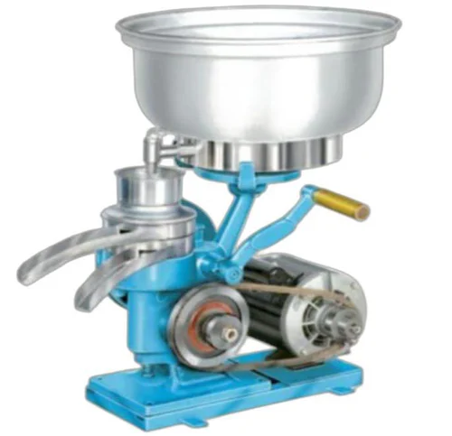 Hand-cranked cream separator with a silver bowl on top. It features a visible belt-driven motor and a handle with a wooden grip.