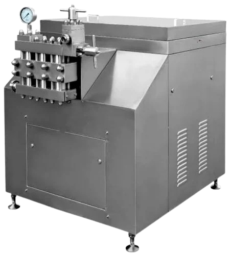 A robust industrial milk homogenizer, constructed from stainless steel, with a prominent manifold and pressure gauge on the left side, designed for high-pressure processing of liquids.