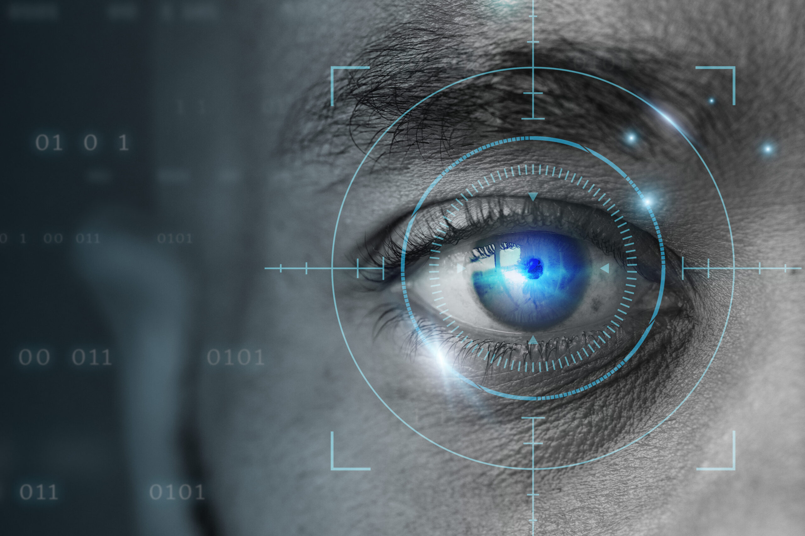 A close-up of a man's eye with a blue, digitally enhanced iris and a target-like graphic overlaid, representing retinal biometrics technology.